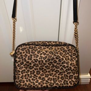 Leopard print Michael Kors crossbody bag.